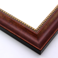 A simple, scooped profile wood frame that adds an elegant touch to your favourite photographs or artwork prints.  The deep sienna brown base overlaid with a similar brown-gold creates a subtle marbled effect that meets an inner edge of gold foil-tipped beading and a gold foil drop edge. The sides of the frame are black.

2 " width: ideal for medium-size artworks.